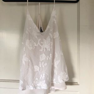 Tank top with sewn flower design